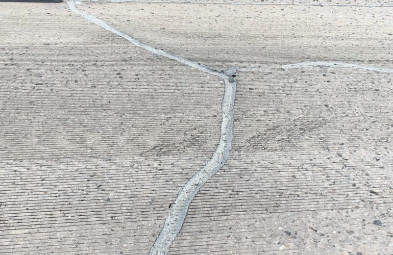 Gray-Sealant-Meandering-Crack